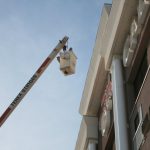 Using an aerial lift to apply bird spikes